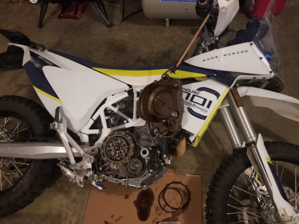 Laying the Husqvarna 701 on its side to modify clutch without oil change